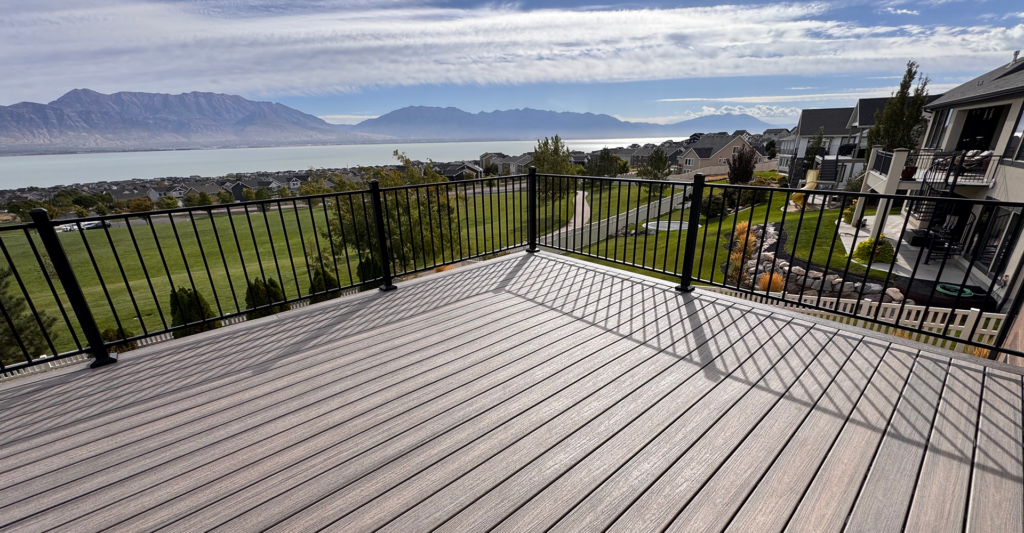 Trex Rocky Harbor composite deck with black aluminum railing overlooking Utah Lake in Saratoga Springs Utah
