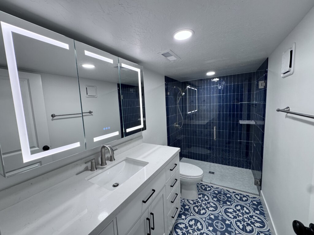 Mapleton Basement Finishing Utah County Basement Bathroom With Curbless Shower And Frameless Enclosure Lighted Vanity Remodelaholic Mapleton Basement Finishing Utah County Basement Bathroom With Curbless Shower And Frameless Enclosure Lighted Vanity Remodelaholic